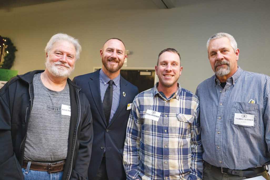 Father Rick, son Matt Parrent with son Kyle and 35-year member/father Thomas Liesener