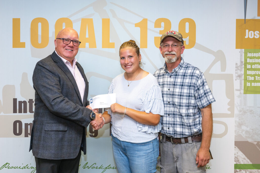 District A scholarship recipient Abigail Schmidt with President/Business Manager Terry McGowan and  father Kevin Schmidt (member). 