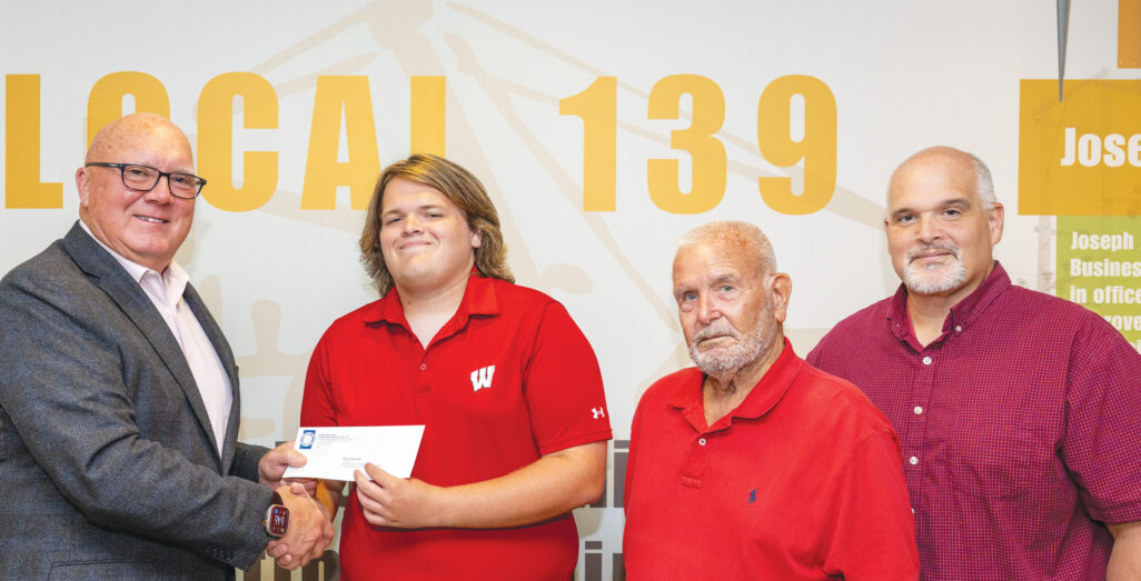 District A scholarship recipient Michael Deschler with
President/Business Manager Terry McGowan, grandfather Jerry Deschler (member) and father Scott Deschler