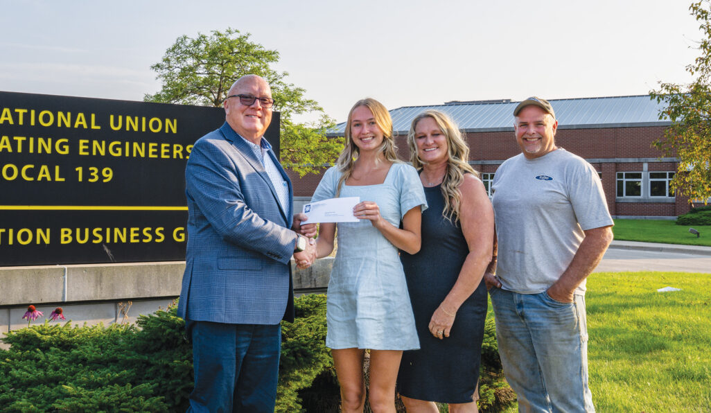 District B scholarship recipient Lynzi Constance Cade with
President/Business Manager Terry McGowan and parents Tracy and Jerry Cade (members).