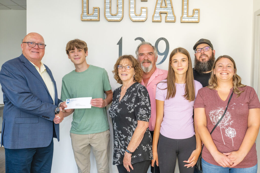 District C scholarship recipient Boyd Czaikowski with President/Business Manager Terry McGowan, grandparents Mary Beth and Edward Czaikowski (member), sister Ellie, and parents Jackie and Nick Czaikowski.