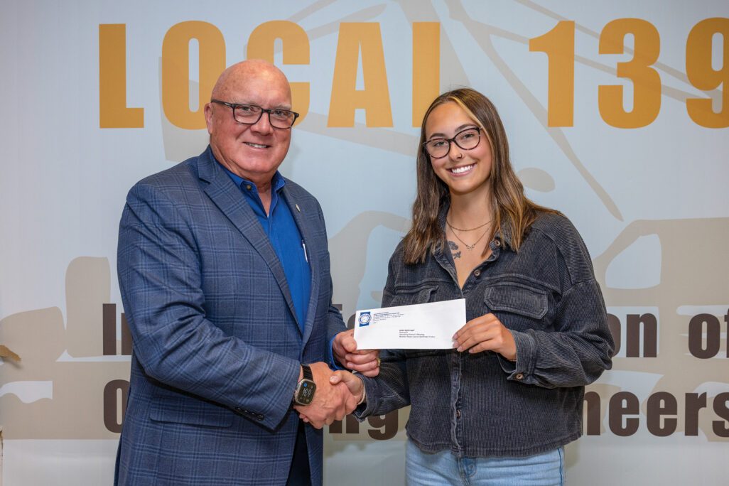 District D scholarship recipient Jaida Spielvogel with President/Business Manager Terry McGowan and father Jayson Spielvogel (member, not present).